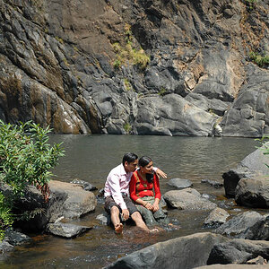 Indian lovers by the waterfal