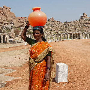 Indian woman with pot on her head (Hampi)