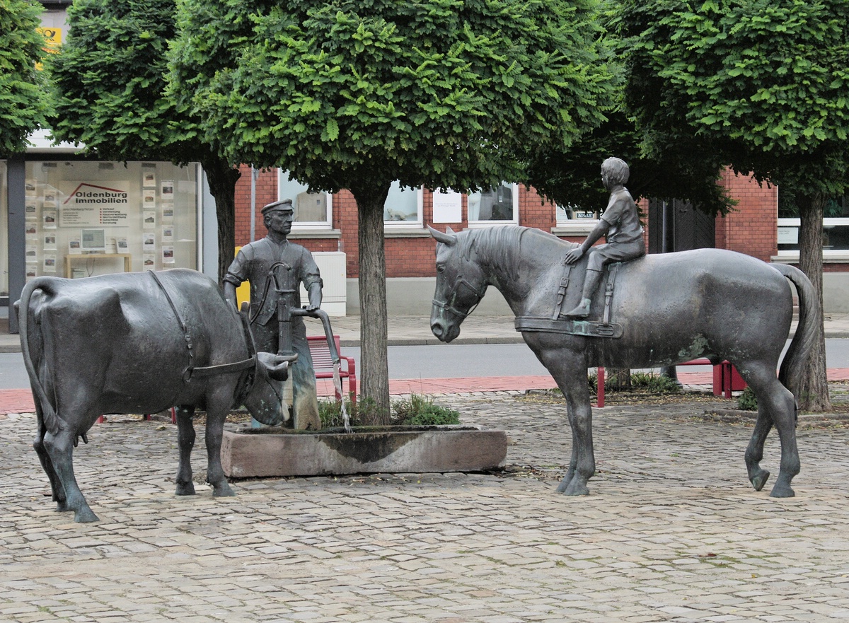 Der Bauer tränkt seine Tiere.jpg