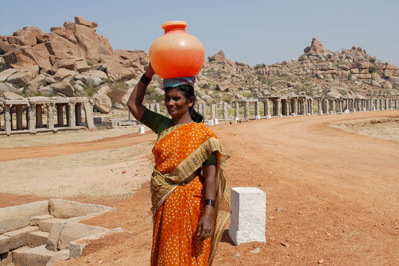 Indian woman with pot on her head (Hampi)