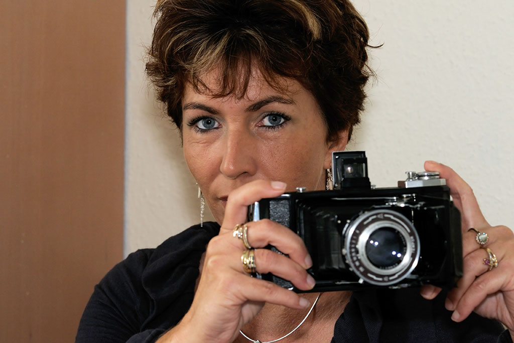 Young lady, old camera